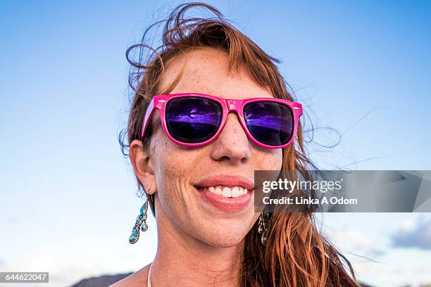 Girl Smiling with Pink Sunglasses