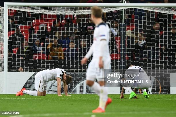 Tottenham Hotspur's English defender Kyle Walker and Tottenham Hotspur's Belgian defender Jan Vertonghen react after Gent scored their second goal...