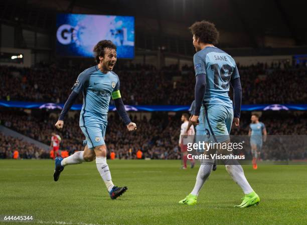 David Silva and Leroy Sane of Manchester City celebrate the first goal during the UEFA Champions League Round of 16 first leg match between...