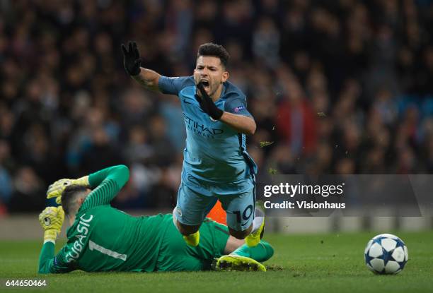 Sergio Aguero of Manchester City is brought down by Danijel Subasic of AS Monaco but is booked for diving during the UEFA Champions League Round of...