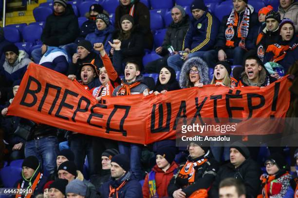 Fans of Shakhtar Donetsk cheer up during the UEFA Europa League Round of 32 second leg match between Shakhtar Donetsk and Celta Vigo at Metalist...