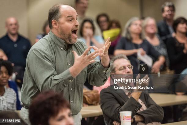 Byron Navey of Florence, South Carolina voices his concerns during a town hall meeting with U.S. Rep. Tom Rice at the Florence County Library on...