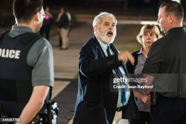 Man argues with law enforcement outside of a town hall meeting with U.S. Rep. Tom Rice at the Florence County Library on February 23, 2017 in...