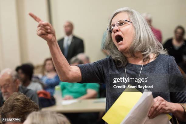Delia Blintz, of Florence, SC, voices her concerns during a town hall meeting with U.S. Rep. Tom Rice at the Florence County Library on February 23,...