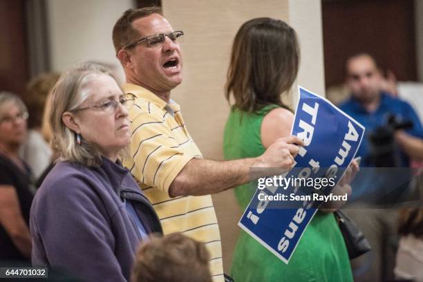 Man shouts at others during a town hall meeting at the Florence County Library on February 23, 2017 in Florence, South Carolina. Hundreds of...
