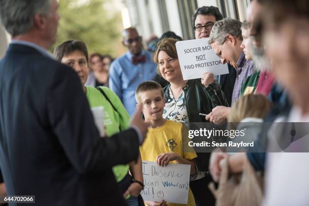 People wait in line before a town hall meeting with U.S. Rep. Tom Rice at the Florence County Library on February 23, 2017 in Florence, South...