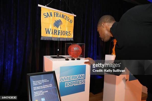 Golden State Warriors legend Antawn Jamison checks out memorabilia during the American Express "All for Dub Nation" Watch Party at Social Hall SF on...