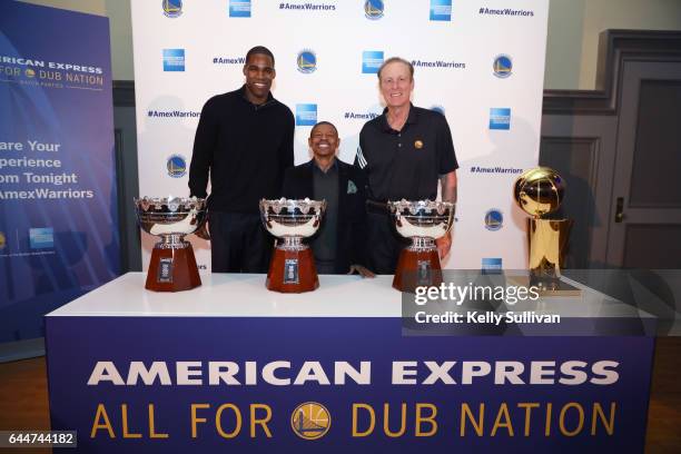 Golden State Warriors legends Antawn Jamison, Muggsy Bogues, and Rick Barry pose for a photo with NBA Championship Trophies during the American...
