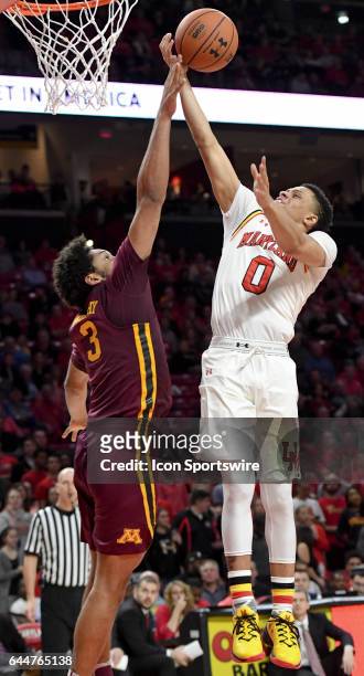 Maryland Terrapins guard Anthony Cowan goes to the basket against Minnesota Golden Gophers forward Jordan Murphy on February 22 at Xfinity Center in...