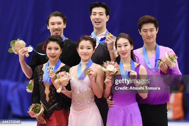 Kana Muramoto and Chris Reed of Japan , Shiyue Wang and Xinyu Liu of China , Hong Chen and Yan Zhao of China pose with their medals during the award...