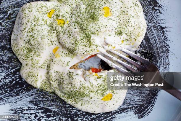 Ravioli de Chucho, Skate Fish & Sweet Plantain Ravioli, Telita Sauce, Dehydrated Salad Powder, Aji Dulce Oil and Squid Ink photographed in Baltimore,...