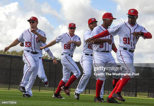 Washington Nationals center fielder prospect Victor Robles, a 19 year-old from the Dominican Republic, right, warms up with his teammates before a...