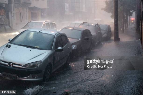 Heavy storm, with hail rain on some periods and strong winds cause floods in downtown Sao Paulo, transforming hillside roads into waterfalls, and the...
