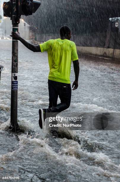 Heavy storm, with hail rain on some periods and strong winds cause floods in downtown Sao Paulo, transforming hillside roads into waterfalls, and the...