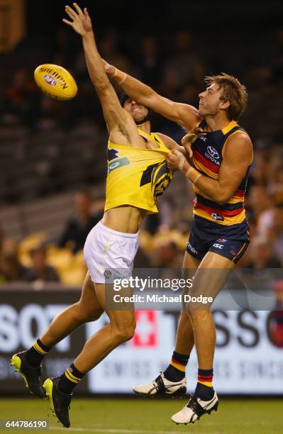 Ben Griffiths of the Tigers competes for the ball against Daniel Talia of the Crows during the JLT Community Series AFL match between the Richmond...