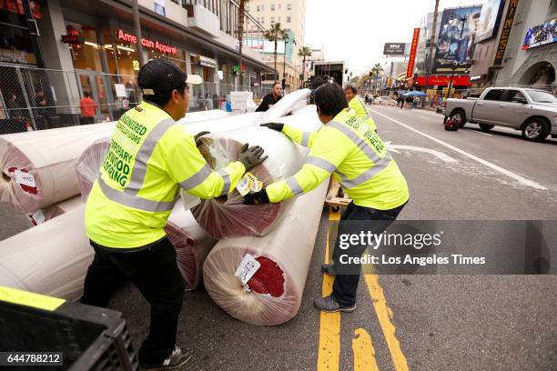 Red carpet arrives by truck on Hollywood Blvd in Hollywood Tuesday evening February 21, 2017 as installers from American Turf and Carpet prepare to...