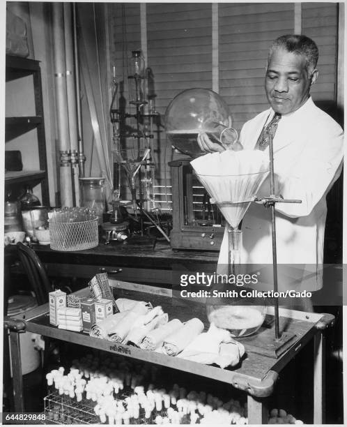Photograph of William R Carter, a government pharmacist, working in an Food and Drug Administration laboratory, 1941. Image courtesy Roger Smith/US...
