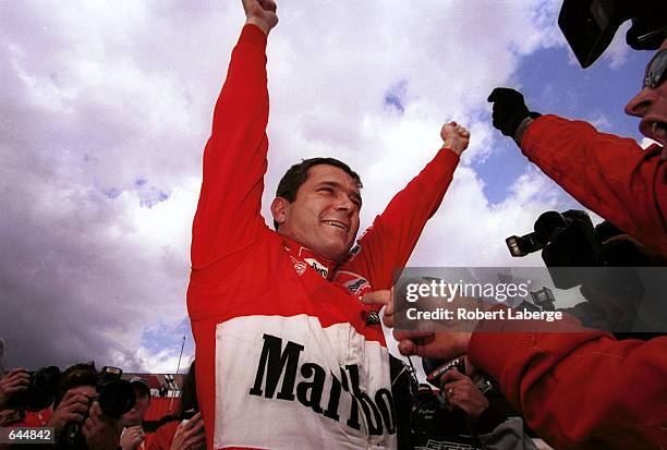 Gil de Ferran celebrates winning the championship after finishing third during the Marlboro 500, round 20 of the C.A.R.T. FedEx Championship series...