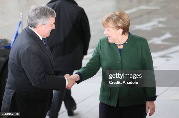 German Chancellor Angela Merkel welcomes European Parliament President Antonio Tajani ahead of their meeting at the German Chancellery in Berlin,...