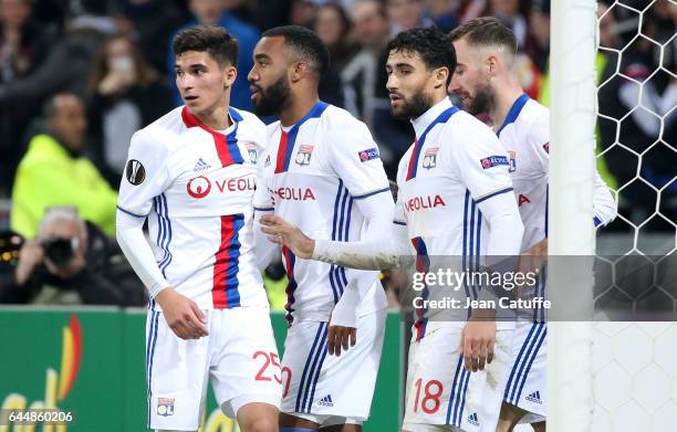 Nabil Fekir of Lyon celebrates his third goal with Houssem Aouar, Alexandre Lacazette during the UEFA Europa League Round of 32 second leg match...