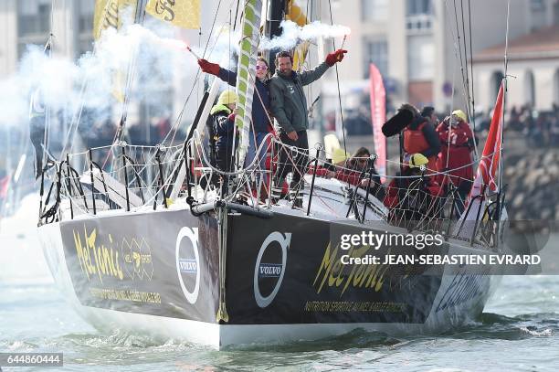 French skipper Romain Attanasio, placing 15th in the Vendee Globe around-the-world solo sailing race, celebrates with his wife Samantha Davies aboard...