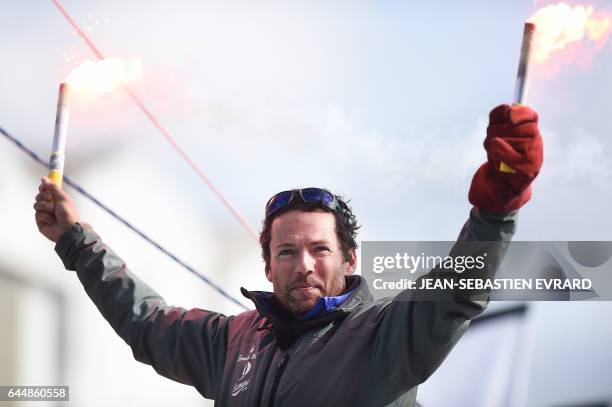 French skipper Romain Attanasio, placing 15th in the Vendee Globe around-the-world solo sailing race, celebrates aboard his Imoca 60 monohull...