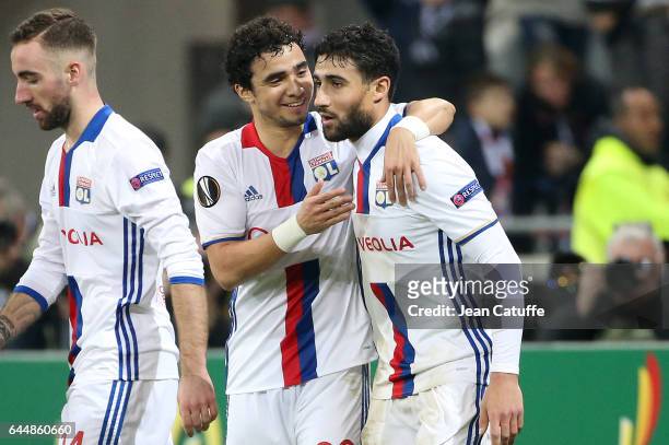 Nabil Fekir of Lyon celebrates his third goal with Rafael da Silva during the UEFA Europa League Round of 32 second leg match between Olympique...