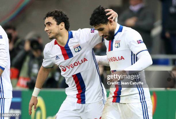 Nabil Fekir of Lyon celebrates his third goal with Rafael da Silva during the UEFA Europa League Round of 32 second leg match between Olympique...