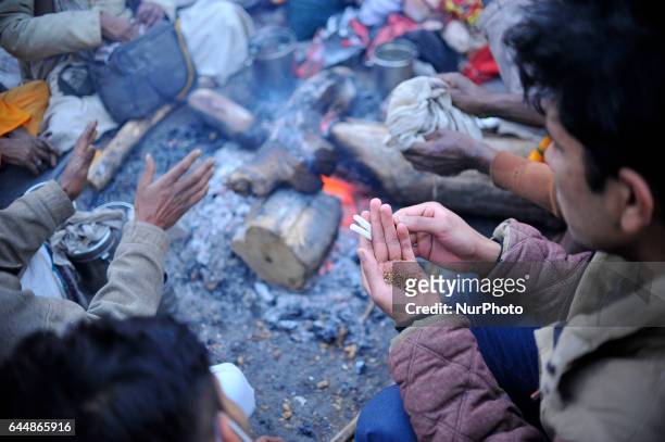 Nepalese Hindu youth making marijuana sticks at the premises of Pashupatinath Temple during the celebration of Maha Shivaratri Festival at Kathmandu,...
