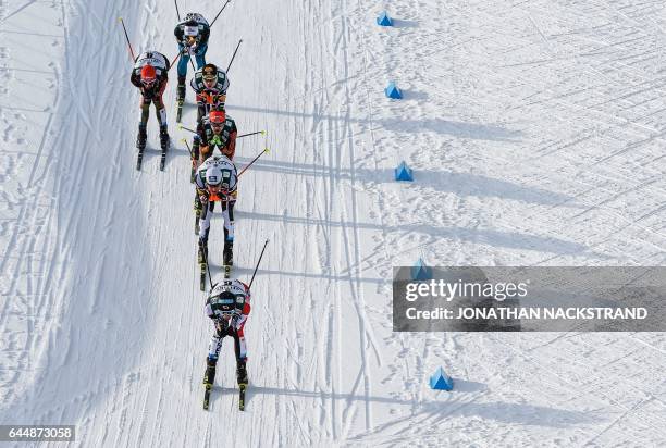 Athletes compete during the men's nordic combined 10 km individual Gundersen event of the 2017 FIS Nordic World Ski Championships in Lahti, Finland,...