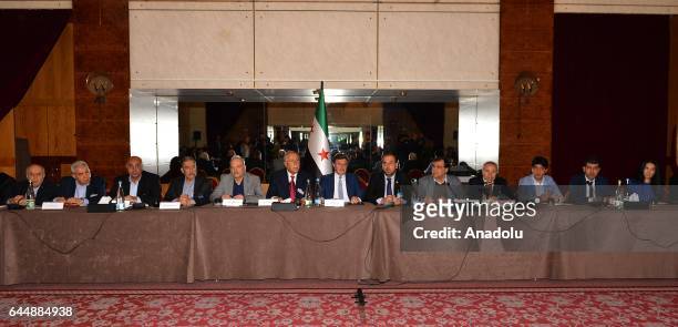 Head of opposition committee Nasr Hariri and Chief negotiator of the opposition delegation Mohamed Sabra attend a meeting on the second day of a new...
