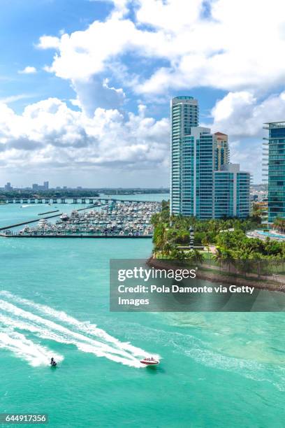 south beach miami from the sea with panoramic view of south pointe park, florida, usa - miami beach stock-fotos und bilder