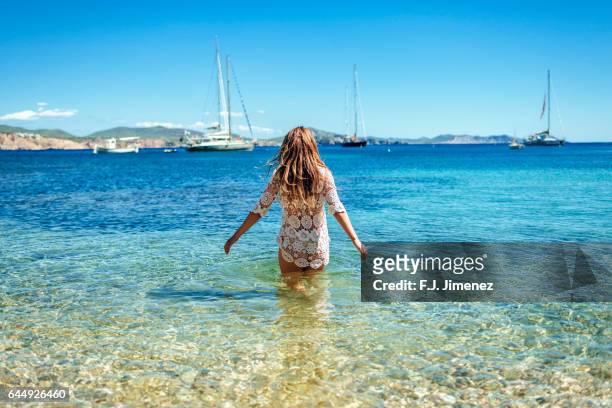 woman at llentrisca beach in ibiza - ibiza stock-fotos und bilder