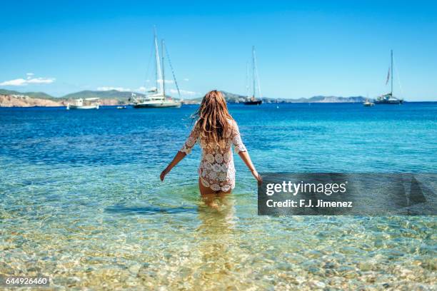 woman at llentrisca beach in ibiza - ibiza island 個照片及圖片檔