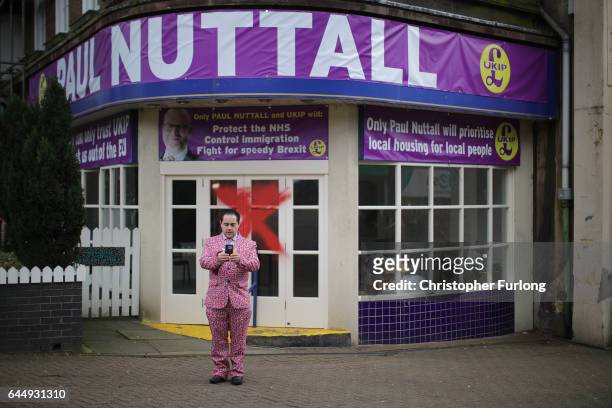 Supporter takes a selfie outside the vandalised UKIP campaign office after their leader Paul Nuttall lost the Stoke Central by-election in Stoke on...