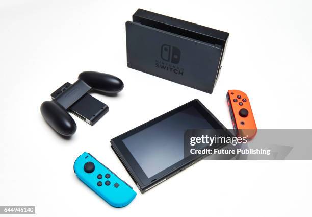 Nintendo Switch console, dock, Joy-Con Grip and a pair of Joy-Con controllers, taken on February 22, 2017.