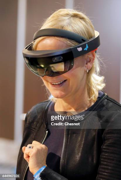 Visitor tries a virtual reality headset Microsoft HoloLens during the show "Virtuality Paris 2017" on February 24, 2017 in Paris, France. Microsoft...