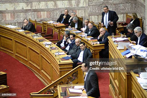 Nikos Pappas, Minister of the Prime Minister Alexis Tsipras speaking in Parliament and Alexis Tsipras listening