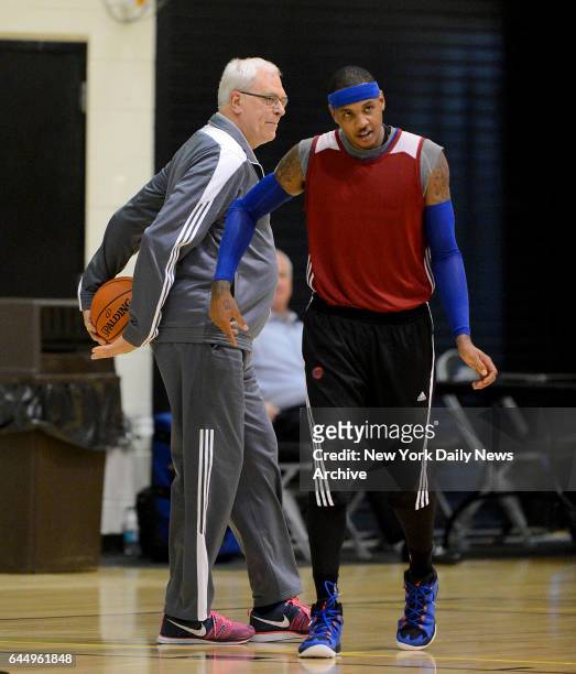 Phil Jackson maintains control of the ball when New York Knicks forward Carmelo Anthony tries to steal the ball from him as he stood watching the...