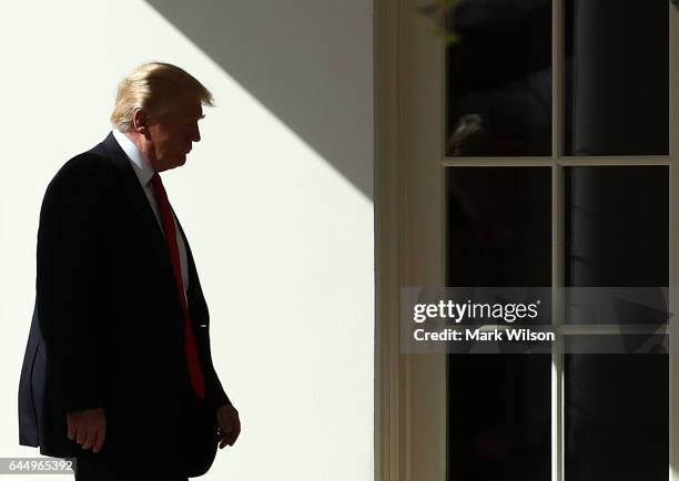 President Donald Trump walks to the Oval Office after arriving back at the White House, on February 24, 2017 in Washington, DC. President Trump made...