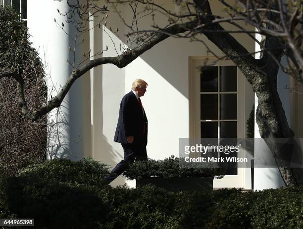 President Donald Trump walks to the Oval Office after arriving back at the White House, on February 24, 2017 in Washington, DC. President Trump made...