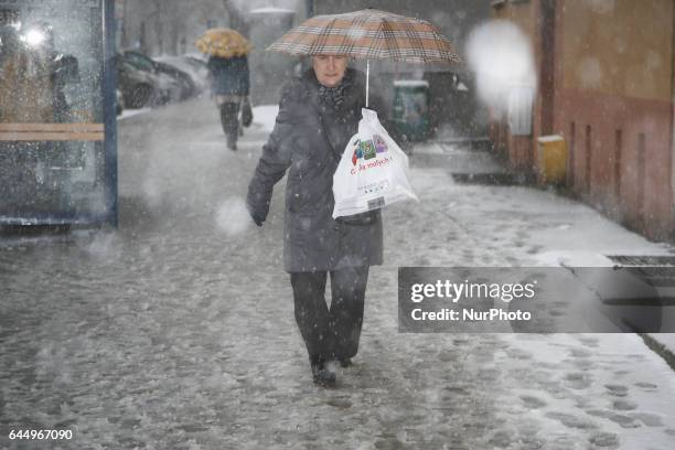 People are seen in the streets of Bydgoszcz, Poland during heavy snowfall on 24 February, 2017.