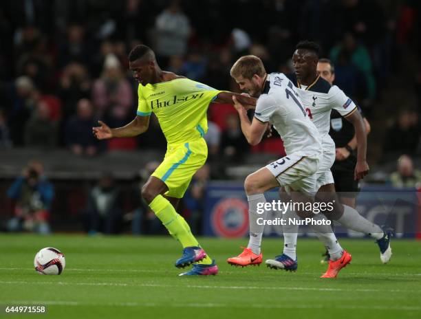 Kalifa Coulibaly of KAA Gent gets his shirt pulled by Tottenham Hotspur's Eric Dier during UEFA Europa League - Round of 32 match between Tottenham...