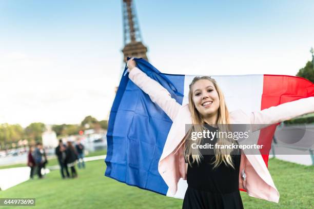 tourist in paris with a french flag - bastille paris stock pictures, royalty-free photos & images