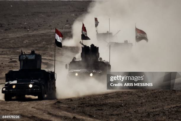 Iraqi troops advance towards Mosul's on February 24, 2017 during an ongoing offensive to retake the northern city from jihadists of the Islamic State...