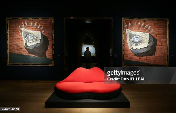 An artwork by Spanish artist Salvador Dali, entitled "Mae West Lips Sofa", with an estimated price of 400,000-600,000 GBP , is pictured in front of...