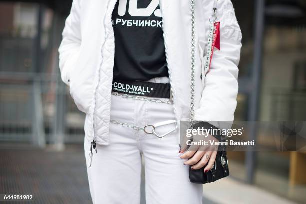 Federica Sciancalepore poses wearing an Opening Ceremony bomber jacket, Gosha Rubchinskiy t-shirt and Off-White belt after the Lucio Vanotti show...