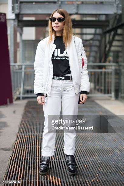 Federica Sciancalepore poses wearing an Opening Ceremony bomber jacket, Gosha Rubchinskiy t-shirt and Off-White belt after the Lucio Vanotti show...