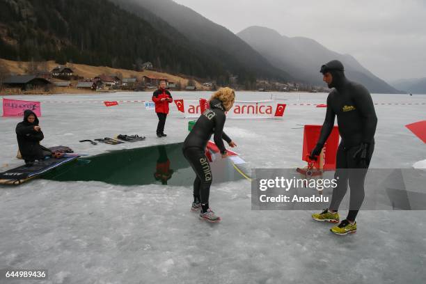 Turkish free diver Derya Can Gocen breaks a new world record with a 120-meter horizontal dive in the ice-covered Lake Weissensee in Weissensee,...