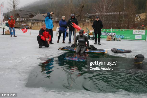 Turkish free diver Derya Can Gocen warms up before breaking a new world record with a 120-meter horizontal dive in the ice-covered Lake Weissensee in...